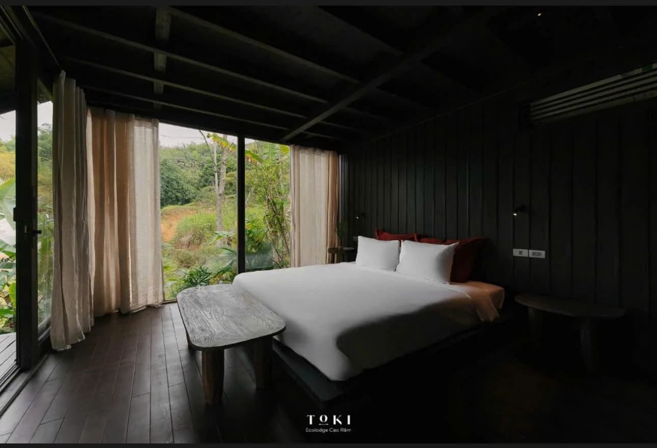 Toki Ecolodge — Bedroom looking out over the valley